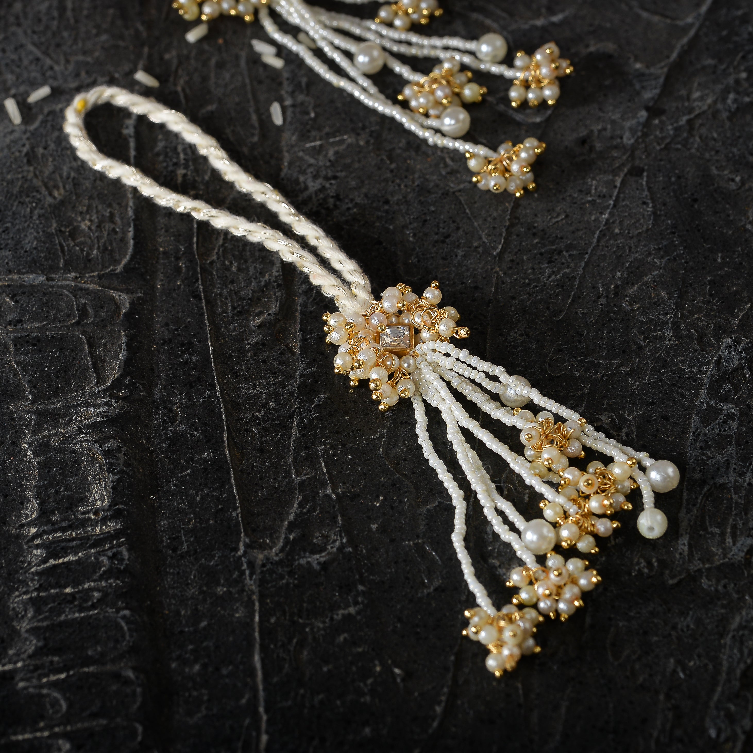Gold plated kundan lumba with pearls tassels